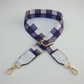 Detail of adjustable purple plaid woven strap with white leather ends and gold metal clips - Gray Grid + White Leather