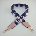 Detail of purple plaid replacement bag strap with golden metal buckles and pink leather ends - Gray Grid + Pink Leather