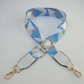 Detail of adjustable geometric strap with gold hooks and white leather ends - Blue White Grid + White Leather
