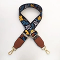 Detail showing adjustable ethnic style wide strap with floral pattern and gold metal hooks - Floral Print (Black/Brown)