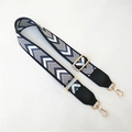 Detail of adjustable chevron patterned strap with gold lobster clasps and black leather ends - Feather Edge + Black