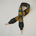 Detail of adjustable wide bag strap featuring sunflower print and gold metal swivel hooks - Sunflower Black Leather