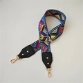Close-up of geometric ethnic pattern wide strap with gold hooks and leather ends - Film Strip Black Leather