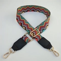 Detail of colorful geometric woven bag strap with golden buckles and leather ends - Wave Pattern + Black Leather Trim