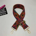 Close-up of geometric ethnic woven wide shoulder strap with gold metal hooks and buckle - Colorful Geometric