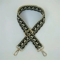 Close-up of retro geometric pattern wide bag strap with golden metal swivel hooks - Black Beige Interlocking Geometric