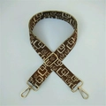 Detail of adjustable geometric bag strap with brown pattern and gold metal hooks - Dark Brown Beige Rounded Rectangle