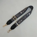 Close-up of ethnic jacquard strap with floral pattern and golden metal swivel hooks - Silver Clasp / No. 5 Black Floral