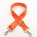 Detail of adjustable bright orange nylon strap with polished gold-tone metal swivel hooks - Orange