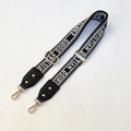 Close-up of adjustable woven shoulder strap with gold metal buckles and leather ends - Letter Studded 3.8 Wide