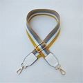 Close-up of thick colorful striped cotton bag strap with gold metal buckle and leather ends - White Style 3