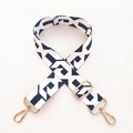 Detailed view of black and white geometric pattern strap with golden metal lobster clasps - Width: 3.8cm / Black and White Chain