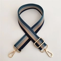 Detail of adjustable striped woven bag strap with navy and beige colors and gold metal buckles - Blue Stripe