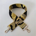 Close-up of leopard pattern bag strap with golden metallic swivel hooks and adjuster - Camouflage Yellow