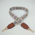 Detail of adjustable ethnic style wide strap with floral embroidery and golden metal hooks - White Circles + Brown Leather Trim