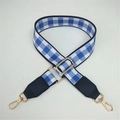 Detail of adjustable blue and white checkered canvas strap with gold swivel hooks - Blue Plaid + Black Leather Trim
