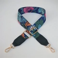 Detail of floral pattern on adjustable nylon bag strap with gold metal buckles - Silver Clasp / Blue Floral with Green Trim