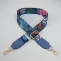 Detail of floral ethnic strap with golden metal hooks and light blue leather trim - Blue Flower + Lake Blue Leather