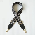 Adjustable black fabric bag strap with white and pink floral pattern and gold metal hooks - Floral Pattern + Black Leather