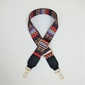 Detail of adjustable bohemian fabric bag strap with golden buckles and ethnic patterns - Rainbow Striped