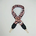 Detail of leopard print bag strap with pink webbing and golden metal buckles - Pink Spots