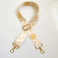 Adjustable wide beige canvas bag strap with gold star pattern and metal hardware - Off White
