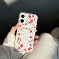 Detailed close-up of transparent iPhone case with real dried flowers and gold flakes - Real Red Flowers / iPhone 7/8/SE 2020