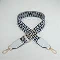 Detail of adjustable black and white woven strap with golden hooks and PU leather ends - Black Weaving with White Leather