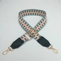 Detail of adjustable woven bag strap with geometric patterns and gold lobster clasps - Contrast Green with Black Leather