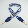 Detail of adjustable woven bag strap with blue geometric pattern and gold swivel hooks - Blue Weaving with Blue Leather