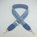 Detail of adjustable geometric woven shoulder strap with blue leather and gold hardware - Lake Blue Weaving with Lake Blue Leather