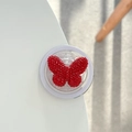 Makroaufnahme einer Handyhalterung mit funkelndem Schmetterling aus roten Kristallen - Magnetic / Rot