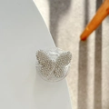 Macro view of butterfly phone grip stand with sparkling rhinestones on acrylic base - Adhesive / White
