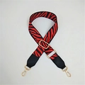 Adjustable bag strap with red and black zebra pattern and gold-tone metal buckles - Red Zebra Print
