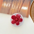 Gros plan d'un support de téléphone en forme de fleur rouge au motif fruit du dragon - Fleur de Cerisier Effet Encre Magnétique - Rouge
