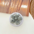 Close-up of flower-shaped phone grip with gray-green marble texture on white surface - Magnetic Ink-wash Cherry Blossom - Grey