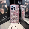 Luxury rhinestone iPhone case with pink bow and pearls on a stylish magazine background - Model: i17 Pro Max / Pink