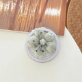 Close-up of matte marble textured floral phone grip with adjustable stand on white surface - Magnetic Ink-wash Cherry Blossom - Cream White