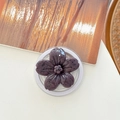 Detail of purple flower phone grip with black speckled texture and transparent base - Magnetic Ink-wash Cherry Blossom - Mauve