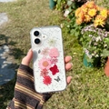 Close-up of glitter phone case with real dried flowers and butterfly under natural light - iPhone 7/8/SE 2020 / Butterfly & Flower - Pink