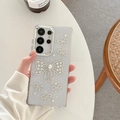 Macro shot of luxury clear phone case with rhinestone bows and white pearl accent - Electroplated Frame-Rhinestone Artificial Pearl Bowknot / Samsung A16