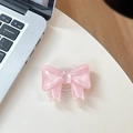 Dettaglio del supporto per telefono a forma di fiocco in resina rosa lucida - Supporto Grande con Fiocco / Rosa Cristallo