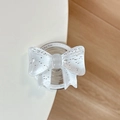 Detail of transparent bow phone grip with silver glitter and Gift For You text base - White