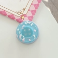 Macro detail of a light blue glitter button phone grip with pink cloud decoration - Magnetic Large Button Cloud Pearlescent / Blue