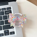 Supporto per telefono a fiocco con paillettes a cuore su tastiera di laptop - Colorato