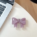 Macro detail of lilac bow phone grip holder on white desk with laptop background - Large Bow Bracket / Crystal Mauve Purple