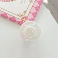 Close-up of a clear resin button with pink and blue clouds for phone grip decor - Adhesive Large Button Cloud Pearlescent / White
