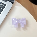 Detailed macro view of light purple bow-shaped phone grip on a white office desk - Large Bow Bracket / Crystal Light Purple