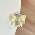 Detail der gelben Schleifen-Handyhalterung mit Glitzer-Harz-Finish für MagSafe - Hellgelb
