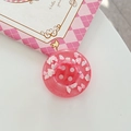 Close-up of pink glitter button phone grip with white cloud charms on plaid decor - Adhesive Large Button Cloud Pearlescent / Red